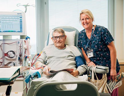 older man and woman smiling